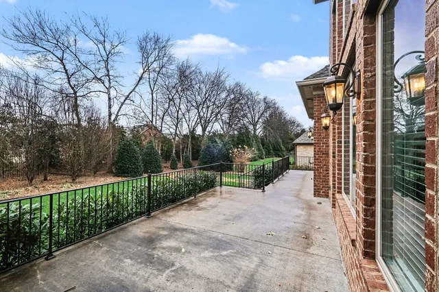 a view of a chair and table in the backyard