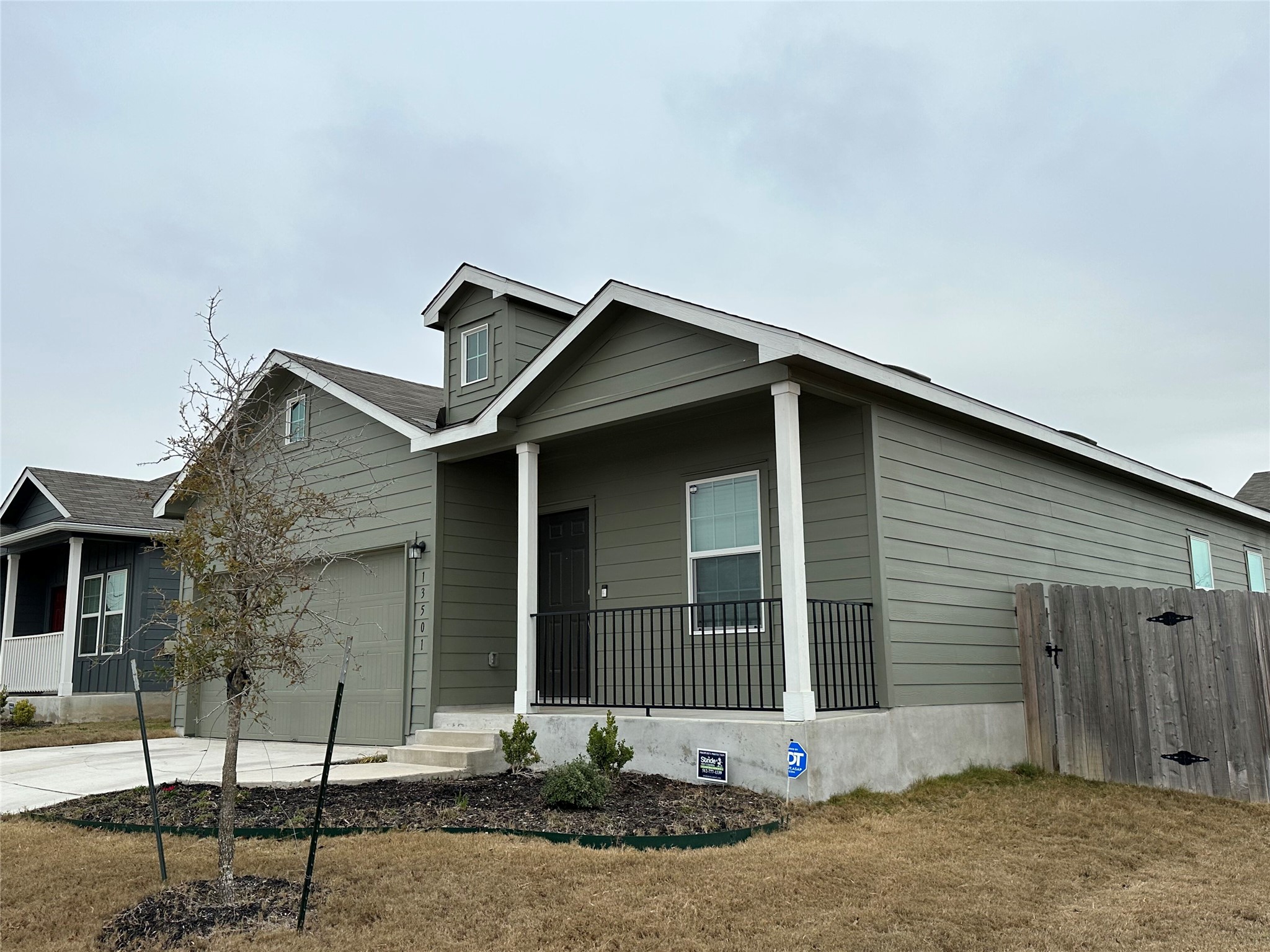 13501 Mussel Run Elgin, TX 78621 - Photo 4 of 28 Ranch-style exterior with sage green siding