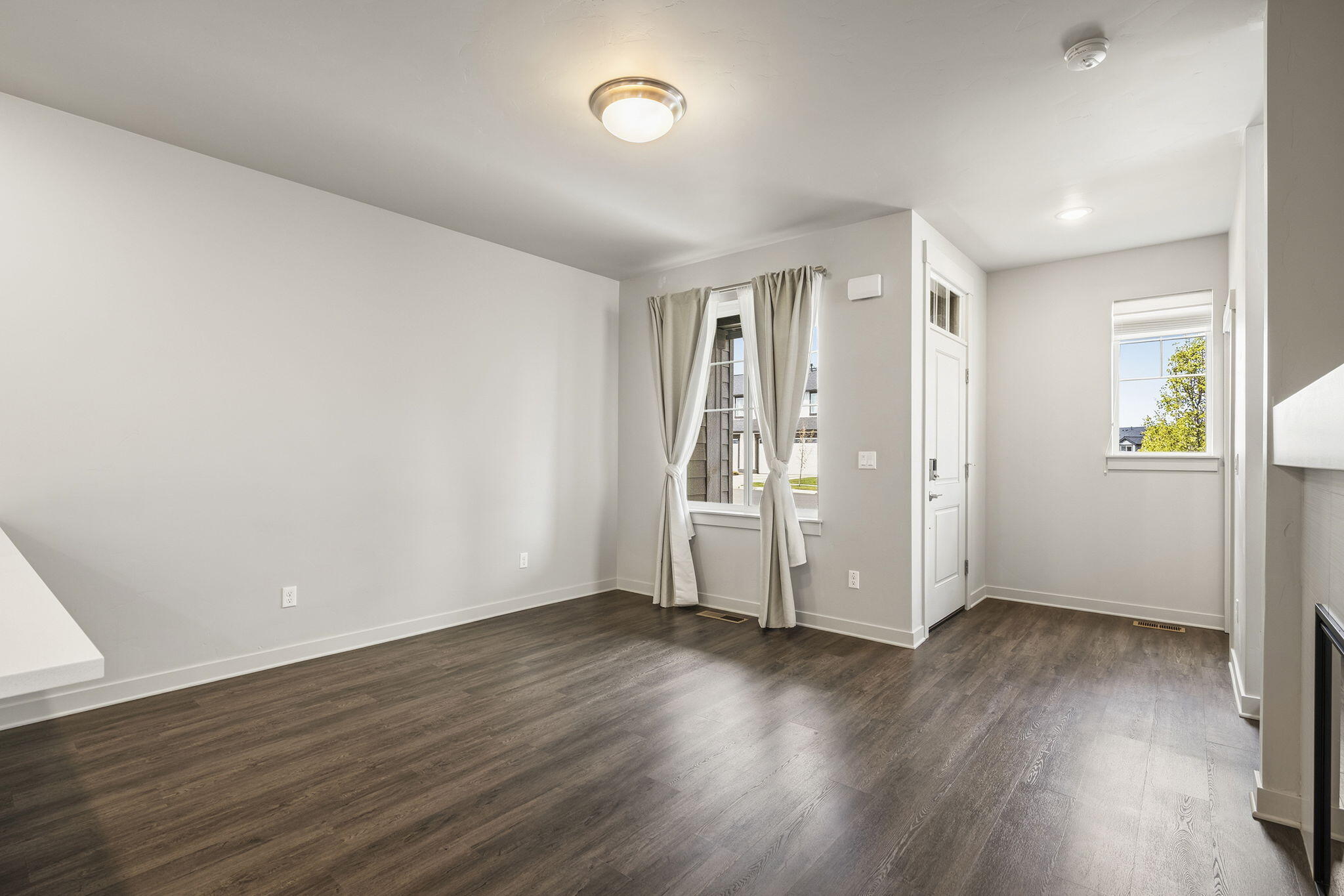2366 Northeast Victor Place Bend, OR 97701 - Photo 6 of 31 an empty room with wooden floor and windows