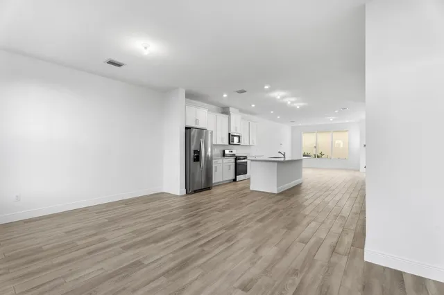 a view of kitchen with wooden floor