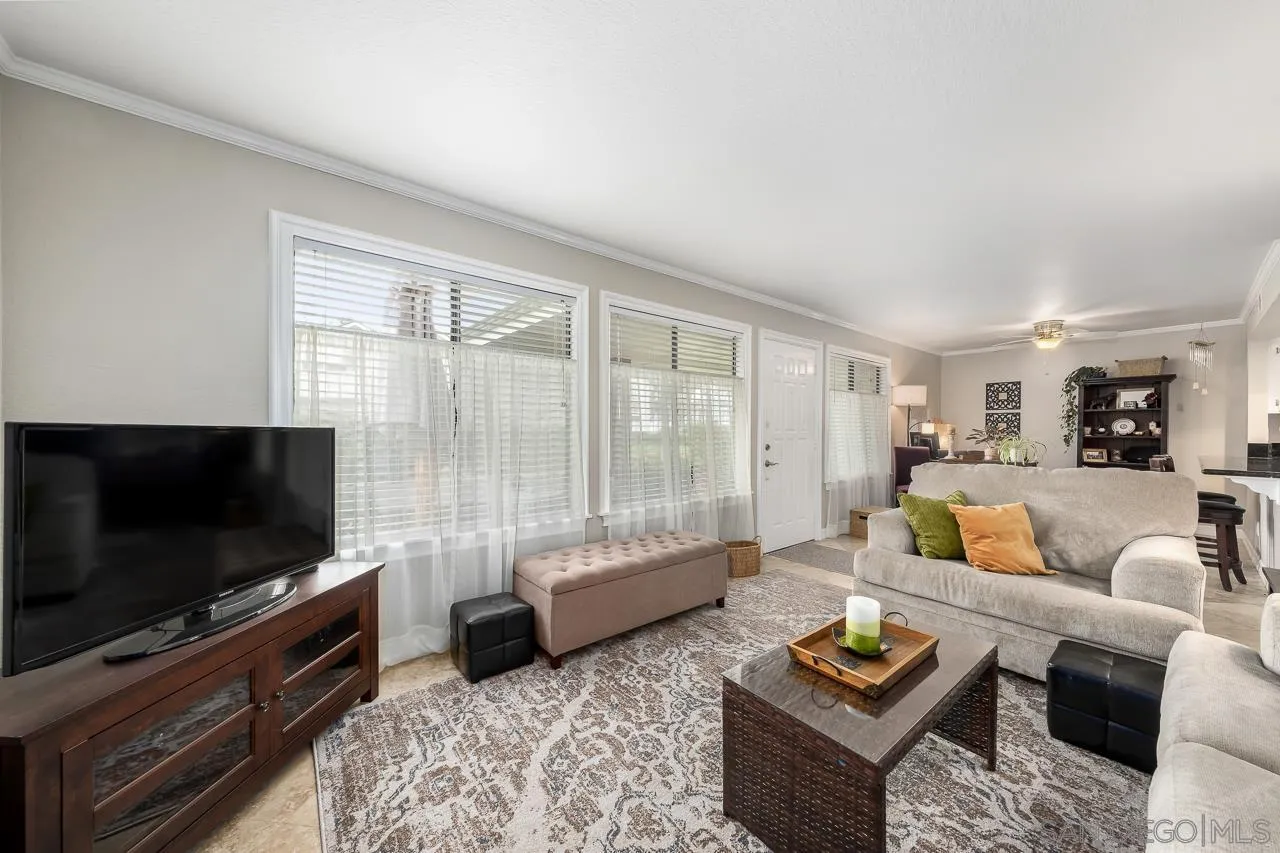 865 Buttercup Road Carlsbad, CA 92011 - Photo 5 of 30 a living room with furniture and a flat screen tv