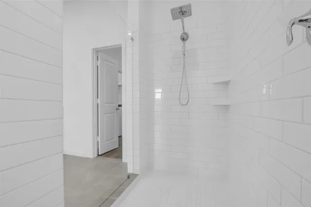 a bathroom with a double vanity sink and a