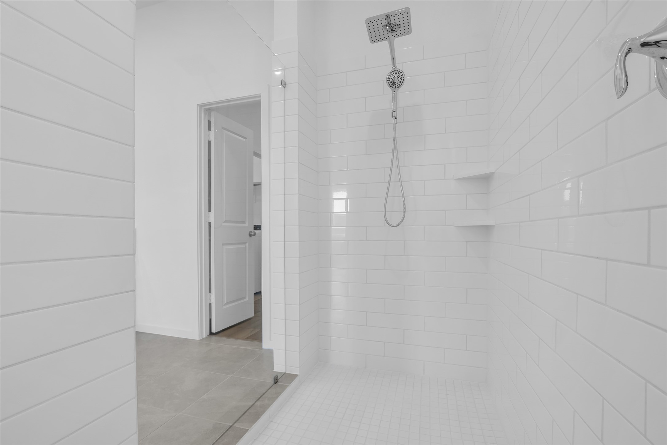 8619 Jade Hl Drive Rosharon, TX 77583 - Photo 30 of 50 Primary Shower: Oversized walk-in design with full tile surround, built-in shelving, and a spa-inspired rain shower that elevates the primary suite experience.