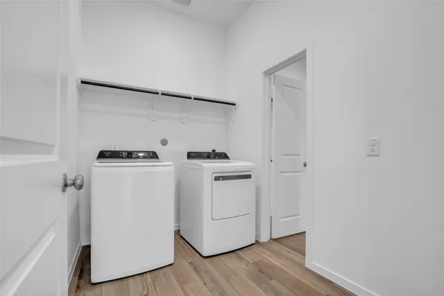 a view of entryway with a window and wooden floor