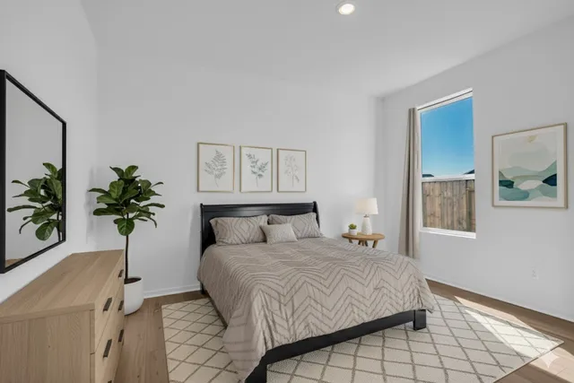 a bathroom with a shower sink vanity and a mirror
