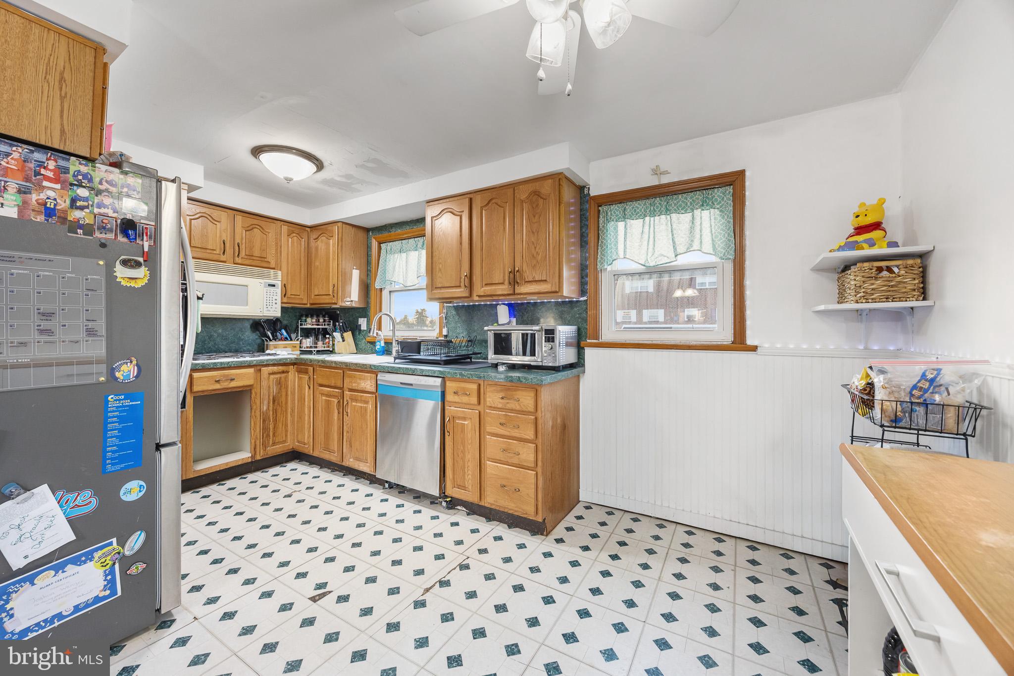 155 Meadow Lane Philadelphia, PA 19154 - Photo 8 of 23 Charming kitchen with classic wooden cabinetry.