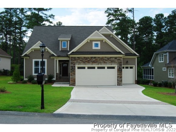 46 Spring Pond Lane Spring Lake, NC 28390 - Photo 1 of 12 a front view of a house with a yard
