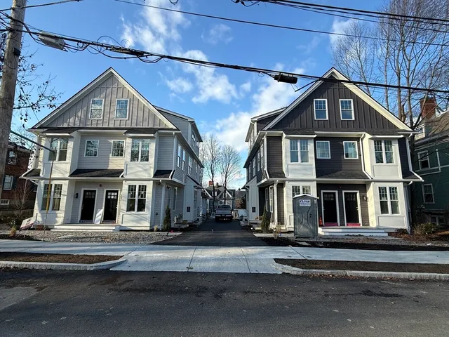 a view of a big house with a street