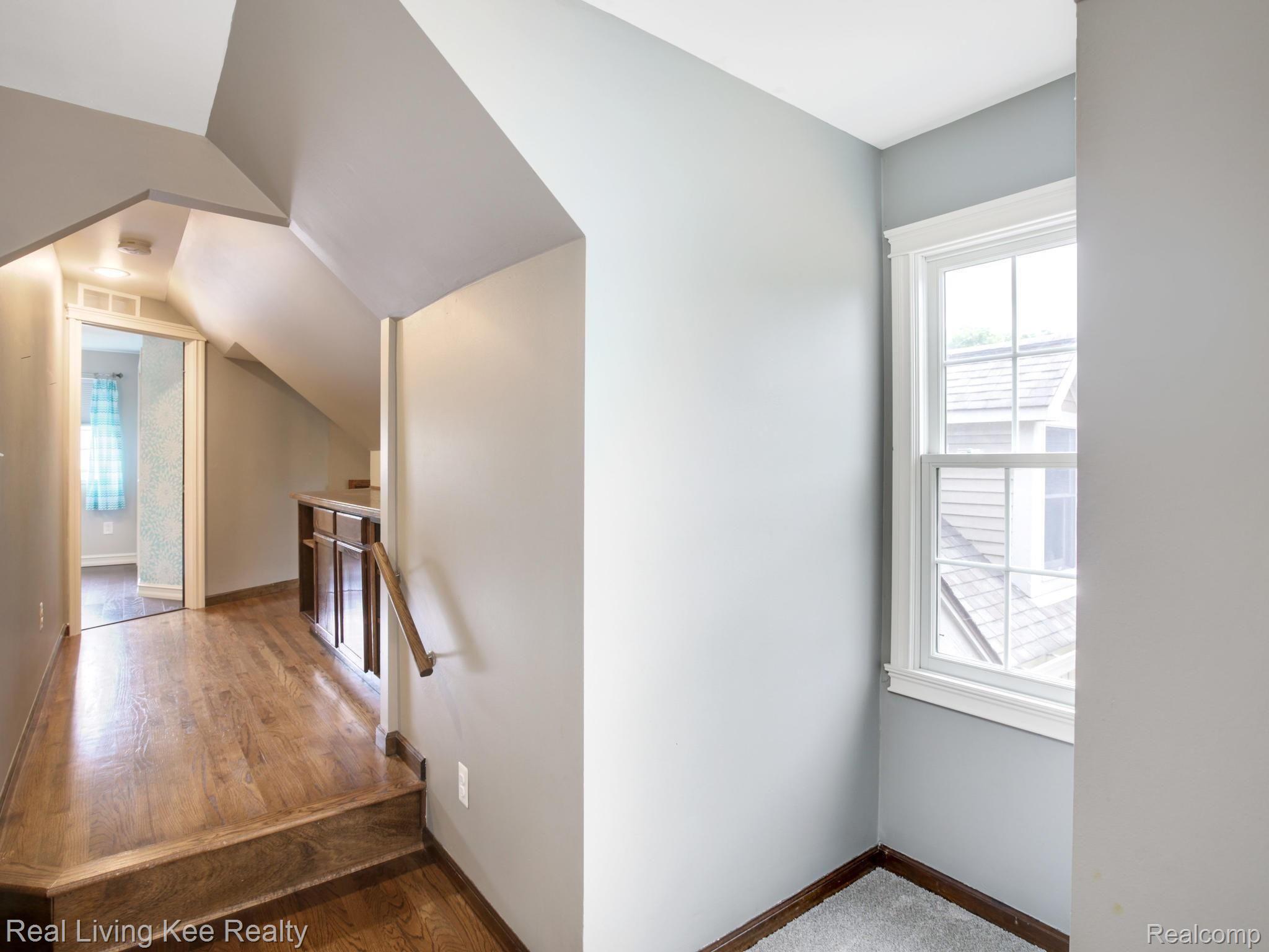 2412 Munster Road Rochester, MI 48309 - Photo 22 of 40 2nd-floor hall to bedrooms #4  Beautiful hardwood flooring, loft area, storage area