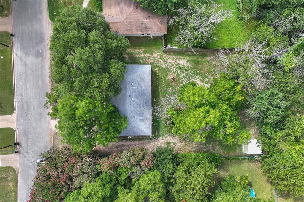 415 Maple Drive Terrell, TX 75160 - Photo 22 of 26 an aerial view of a house with a yard
