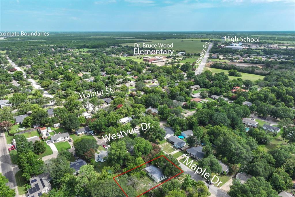 415 Maple Drive Terrell, TX 75160 - Photo 23 of 26 an aerial view of residential houses with outdoor space and trees