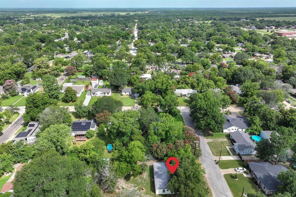 415 Maple Drive Terrell, TX 75160 - Photo 25 of 26 an aerial view of residential houses with outdoor space and trees