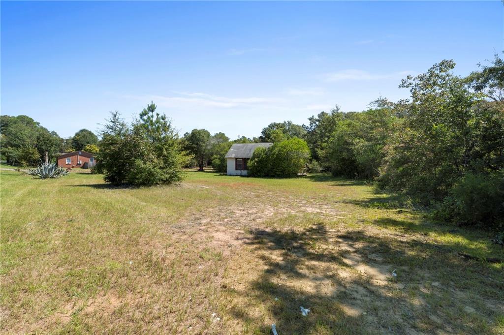 4742 Bloomfield Road Macon, GA 31206 - Photo 13 of 18 a view of a field with an trees in the background