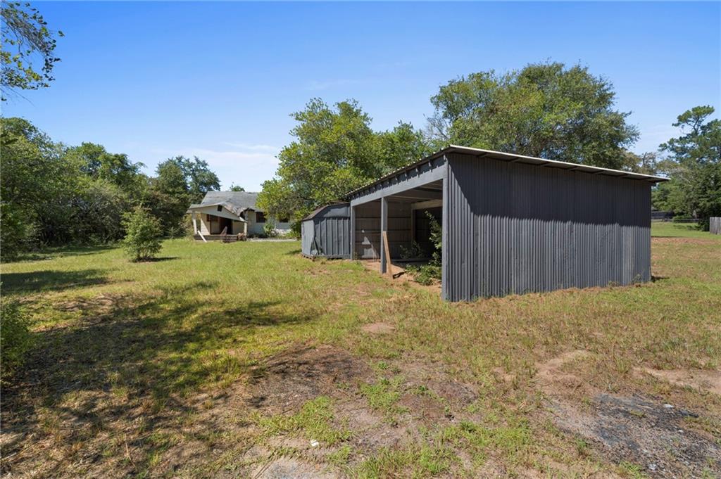 4742 Bloomfield Road Macon, GA 31206 - Photo 16 of 18 a view of a house with backyard and trees