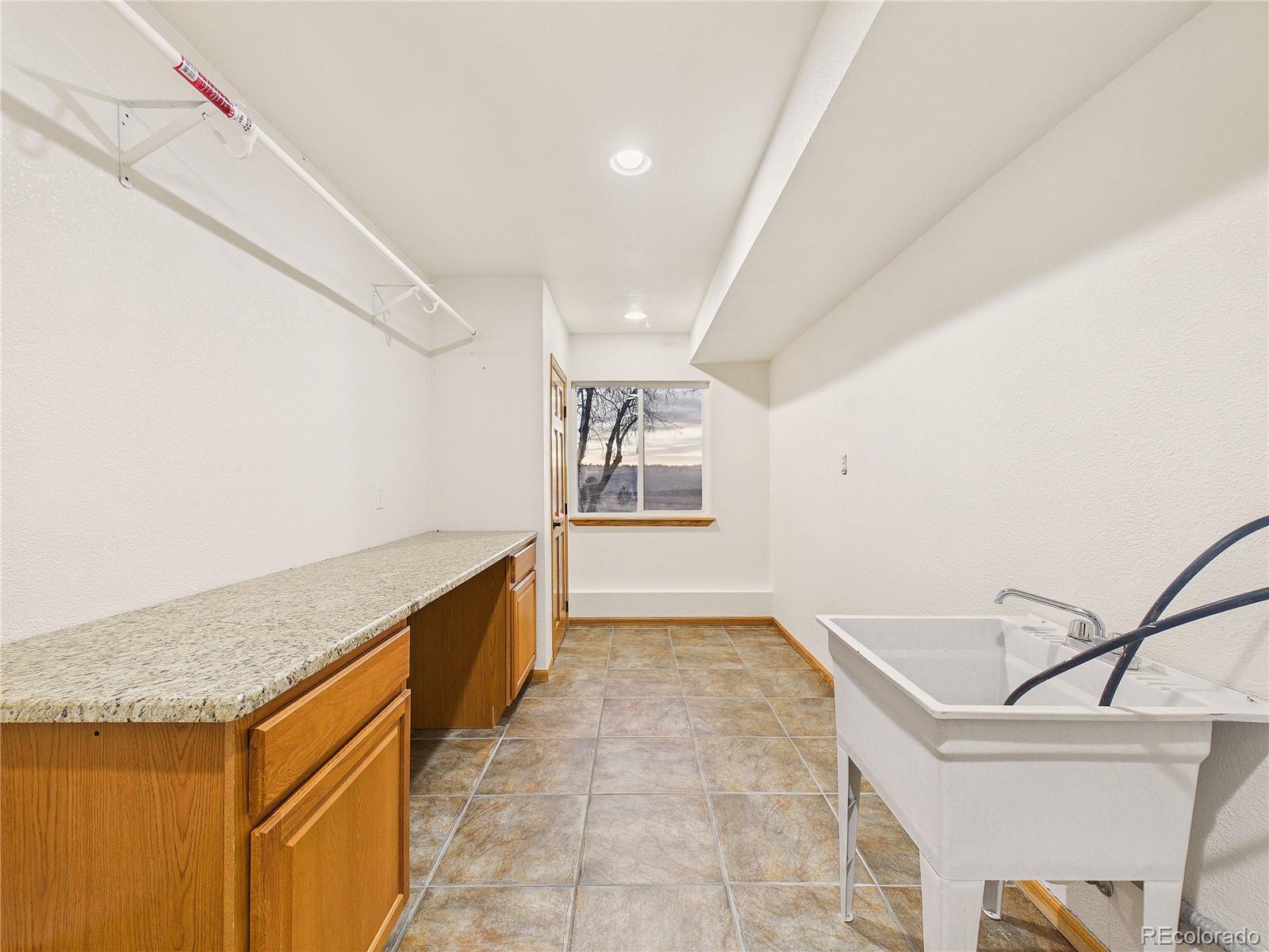 6423 Arrowhead Trail Elizabeth, CO 80107 - Photo 32 of 46 a view of an empty room with kitchen