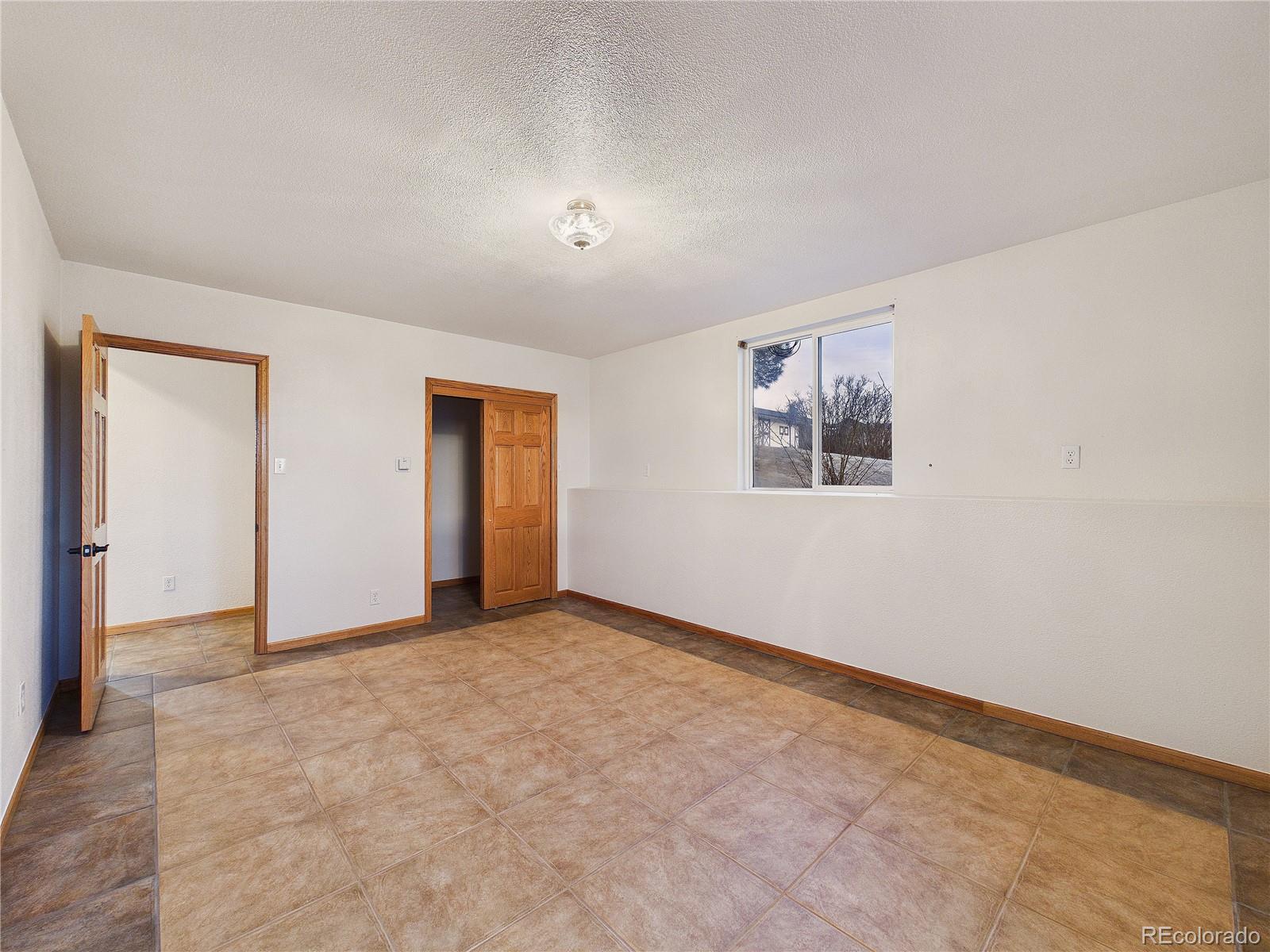 6423 Arrowhead Trail Elizabeth, CO 80107 - Photo 33 of 46 a view of an empty room with a window