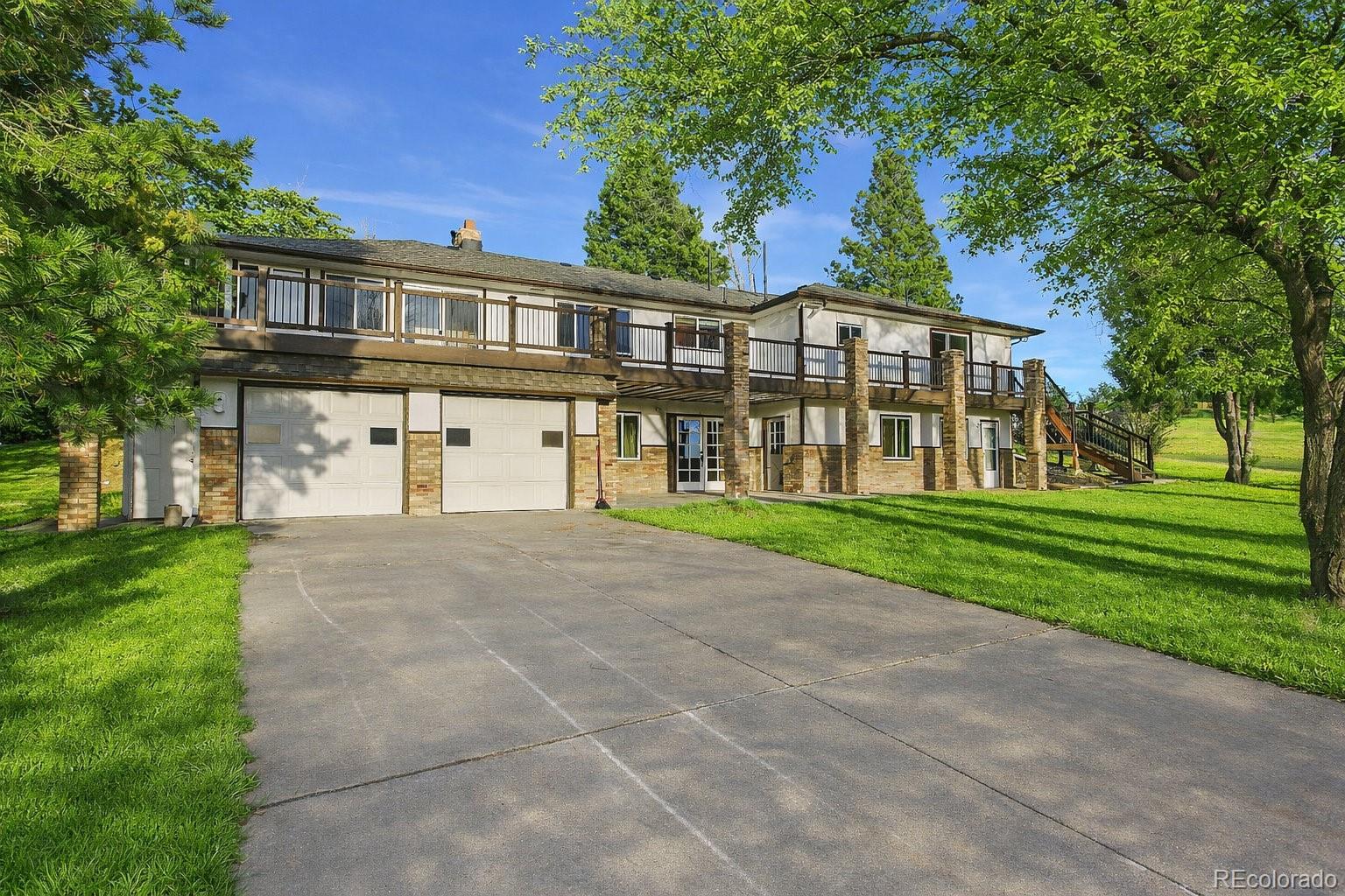6423 Arrowhead Trail Elizabeth, CO 80107 - Photo 38 of 46 a front view of a house with a yard