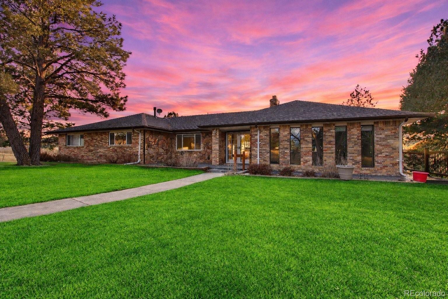 6423 Arrowhead Trail Elizabeth, CO 80107 - Photo 6 of 46 a view of a house with a yard