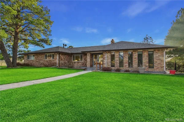 a kitchen with stainless steel appliances granite countertop a stove top oven a sink dishwasher a refrigerator and a microwave