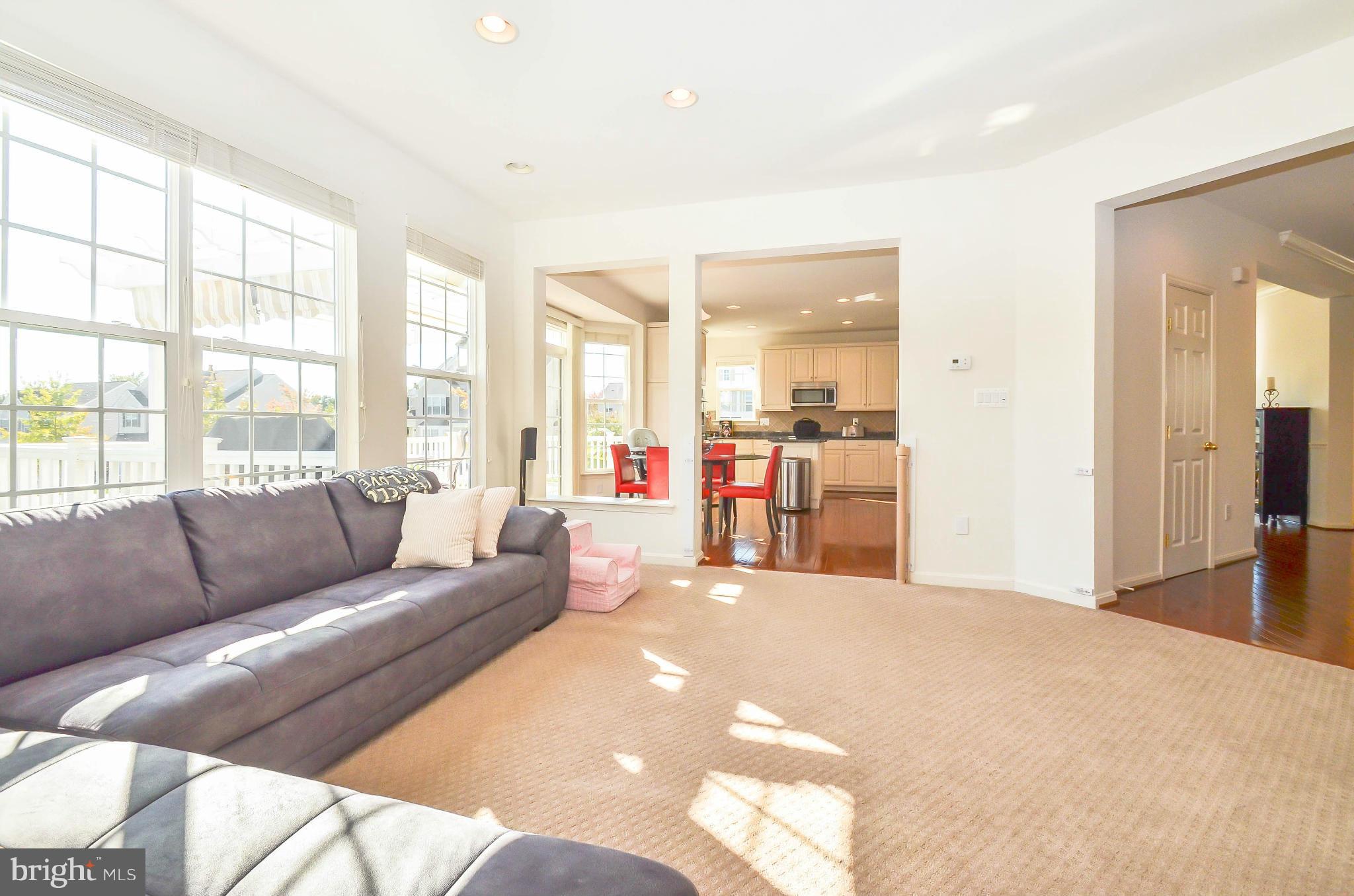 6620 Pebble Brooke Road Baltimore, MD 21209 - Photo 11 of 30 a living room with furniture and a large window