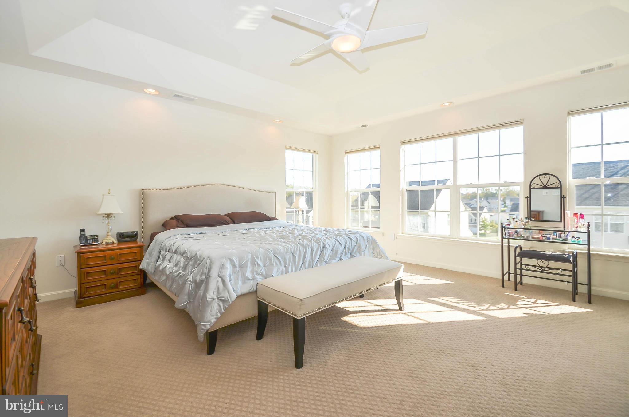 6620 Pebble Brooke Road Baltimore, MD 21209 - Photo 14 of 30 a bedroom with a bed and a large window with the outer view