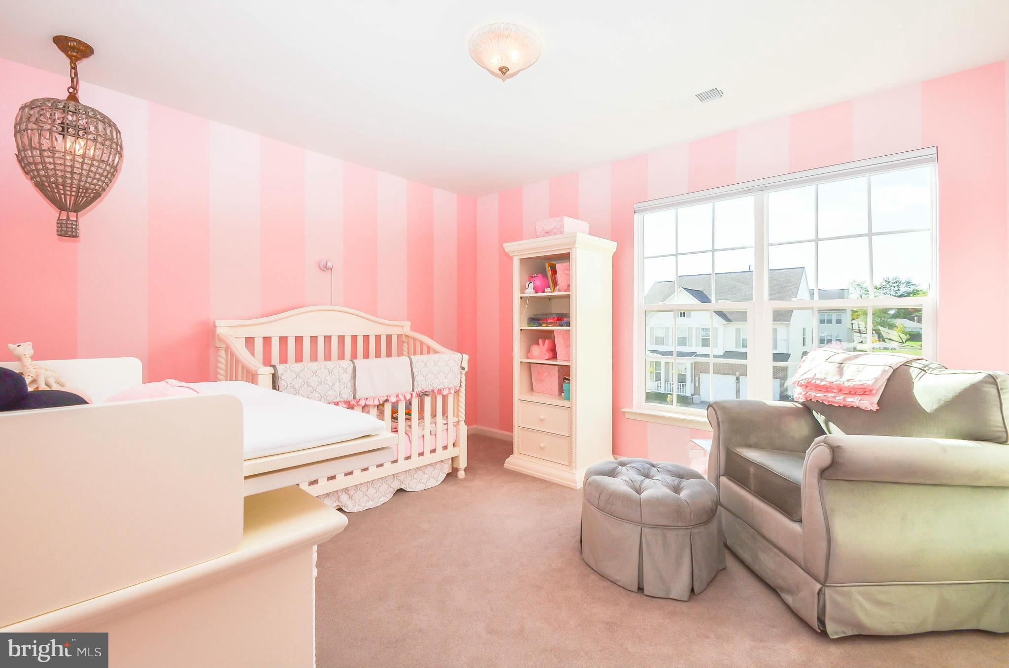 6620 Pebble Brooke Road Baltimore, MD 21209 - Photo 18 of 30 a bedroom with furniture and a large window