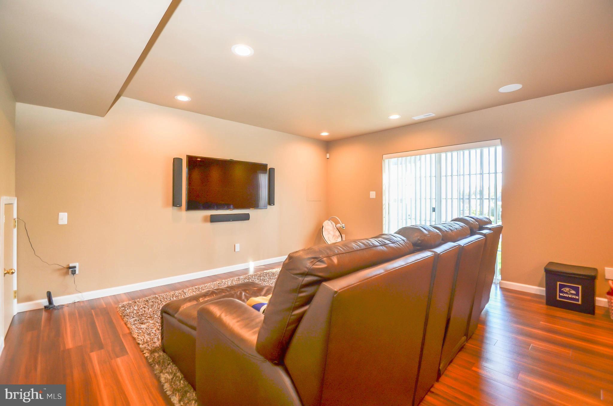 6620 Pebble Brooke Road Baltimore, MD 21209 - Photo 20 of 30 a living room with furniture and a flat screen tv