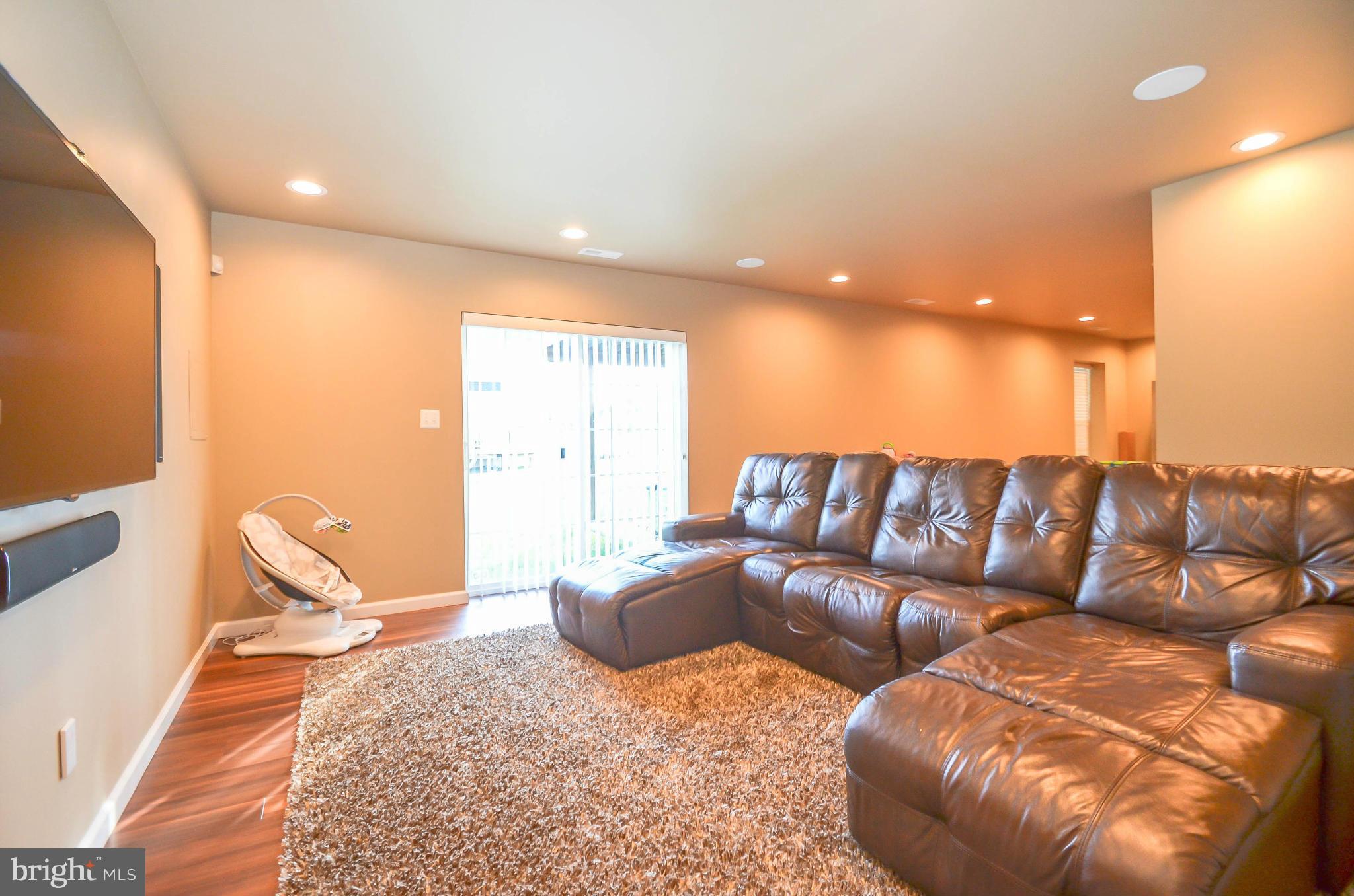 6620 Pebble Brooke Road Baltimore, MD 21209 - Photo 21 of 30 a living room with a couch and a rug