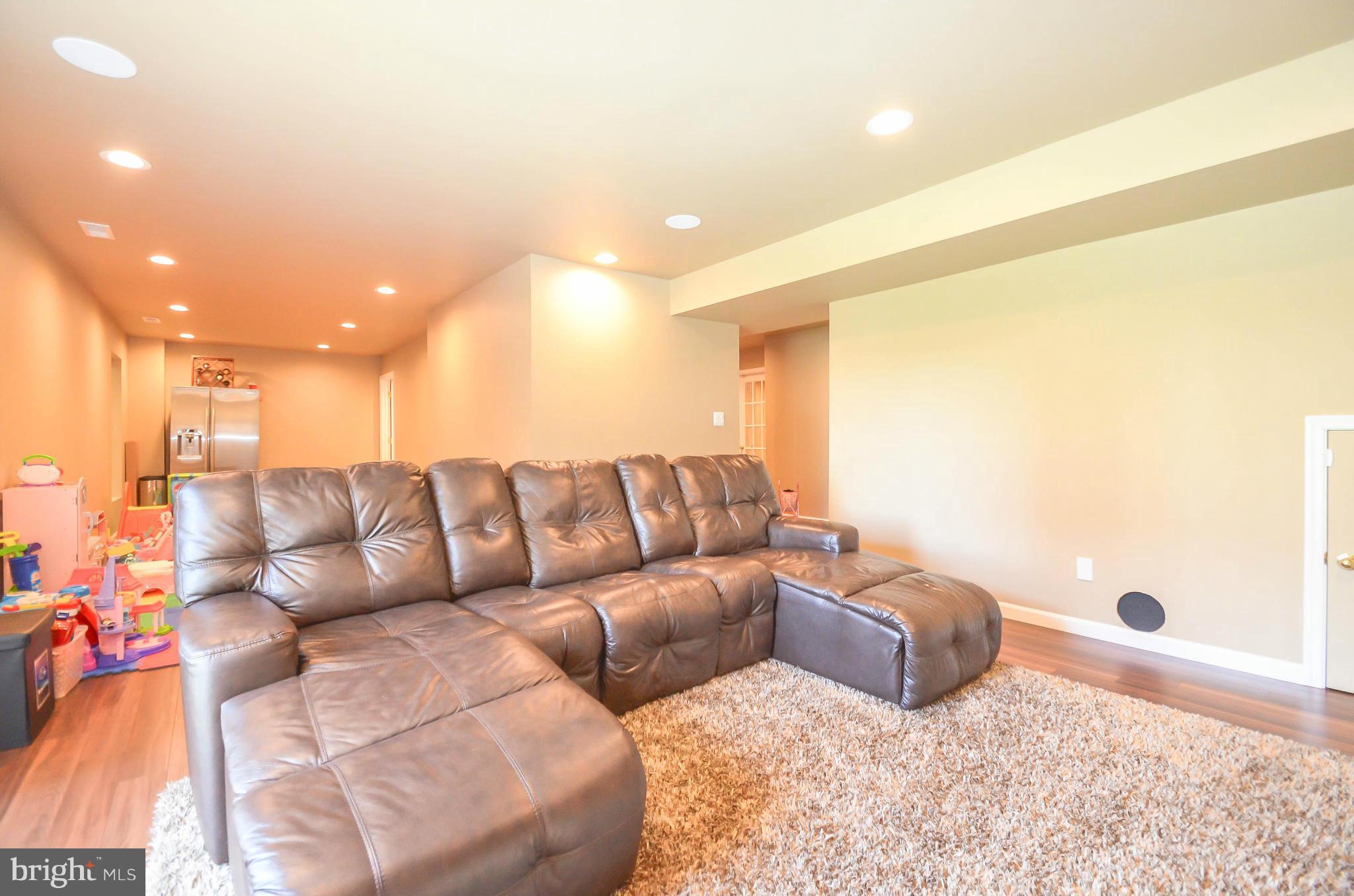 6620 Pebble Brooke Road Baltimore, MD 21209 - Photo 22 of 30 a living room with a couch and a couch