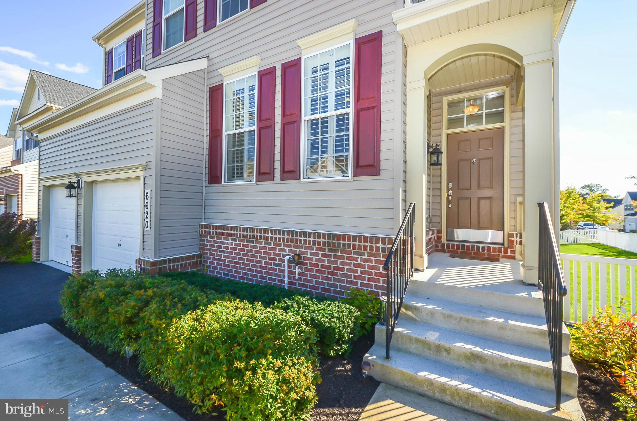 6620 Pebble Brooke Road Baltimore, MD 21209 - Photo 24 of 30 a front view of a house with a garden