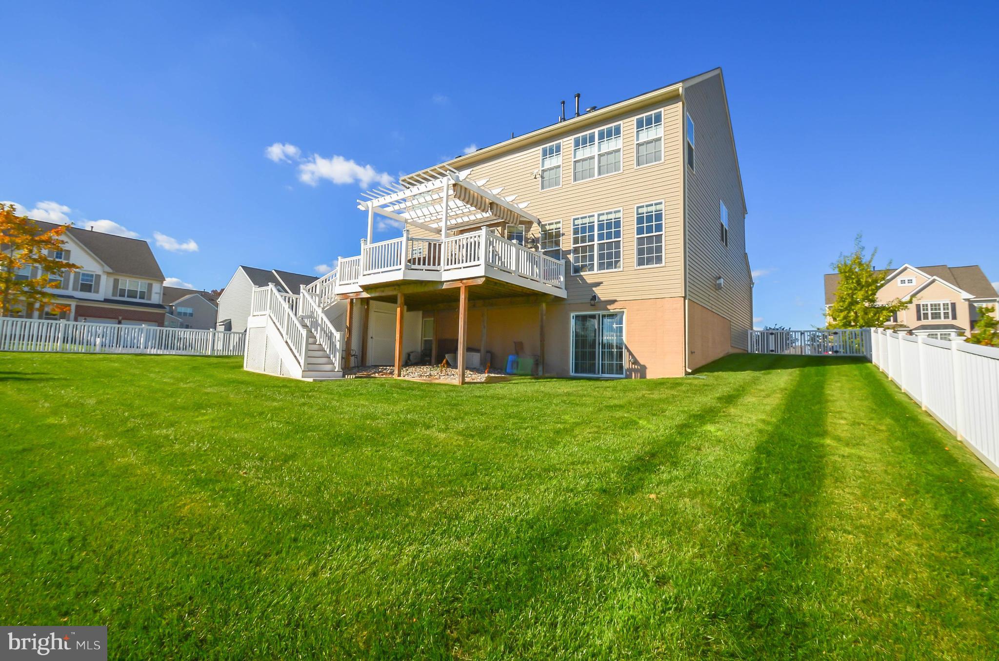 6620 Pebble Brooke Road Baltimore, MD 21209 - Photo 27 of 30 a view of a house with a yard