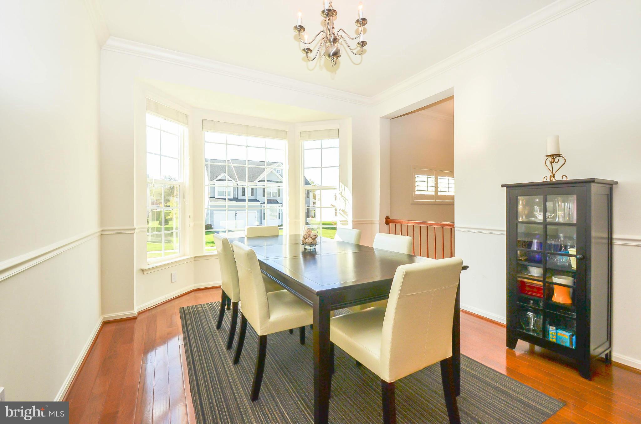 6620 Pebble Brooke Road Baltimore, MD 21209 - Photo 4 of 30 a view of a dining room with furniture window and wooden floor