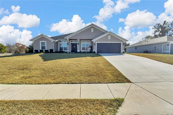 a front view of a house with yard