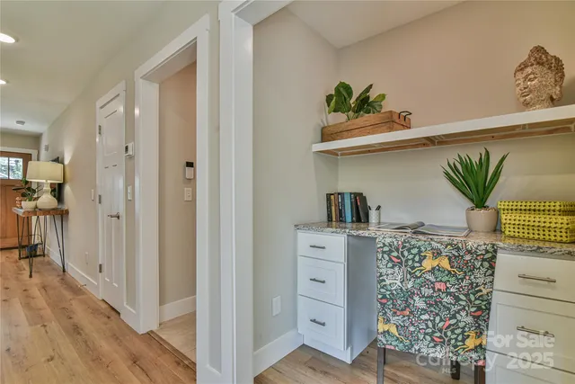 a view of kitchen with furniture and wooden floor
