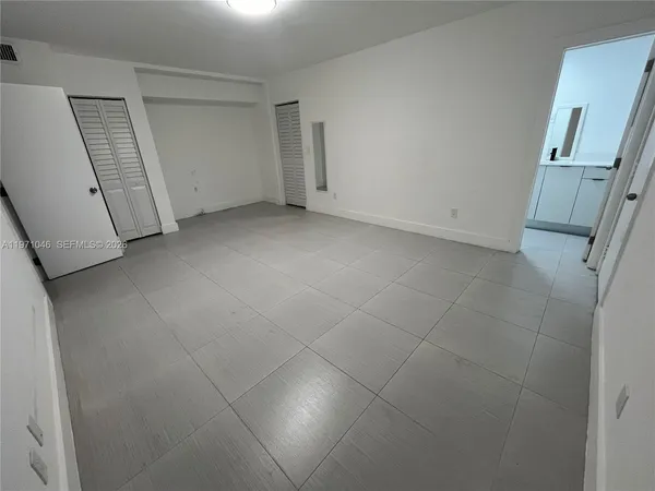 an empty room with a bathroom