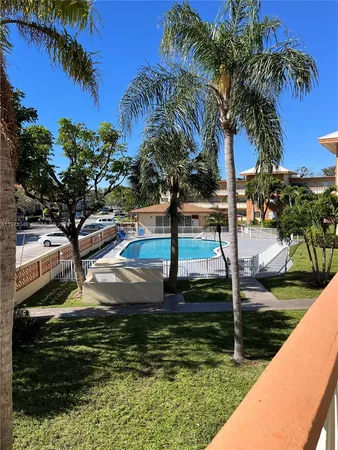 a view of swimming pool with a yard