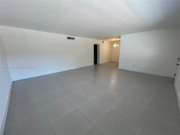 a view of a big room with closet and bathroom