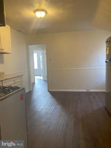 a view of a livingroom with wooden floor