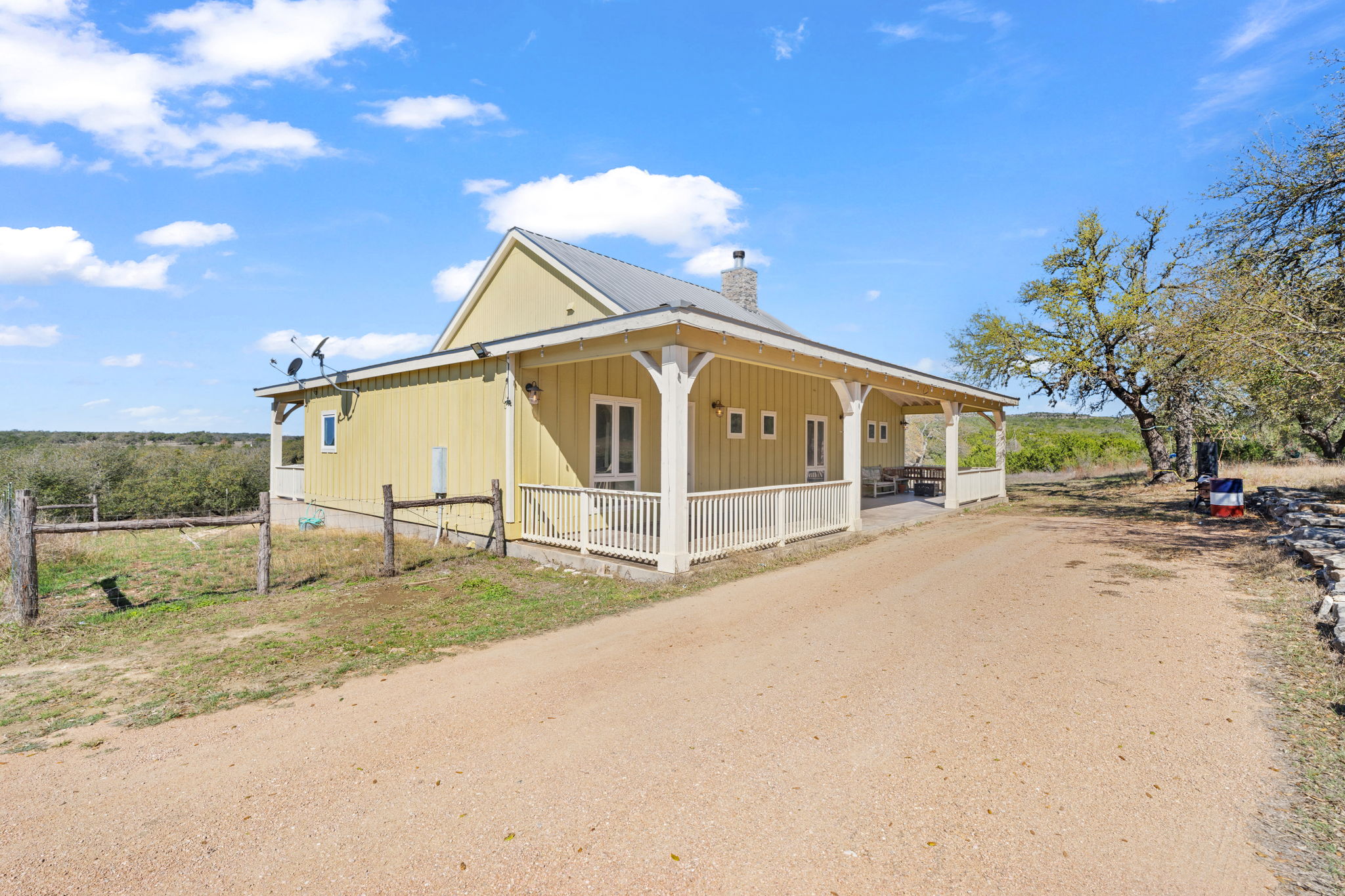 6350 Mt Sharp Road, Unit B Wimberley, TX 78676 - Photo 31 of 34 a view of a house with a patio