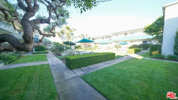 a view of a garden with a houses