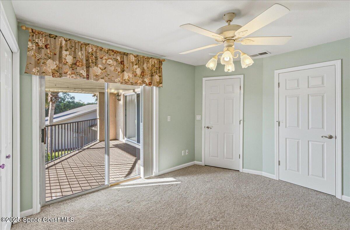 4129 Bond Avenue Rockledge, FL 32955 - Photo 22 of 45 an empty room with windows and entrance