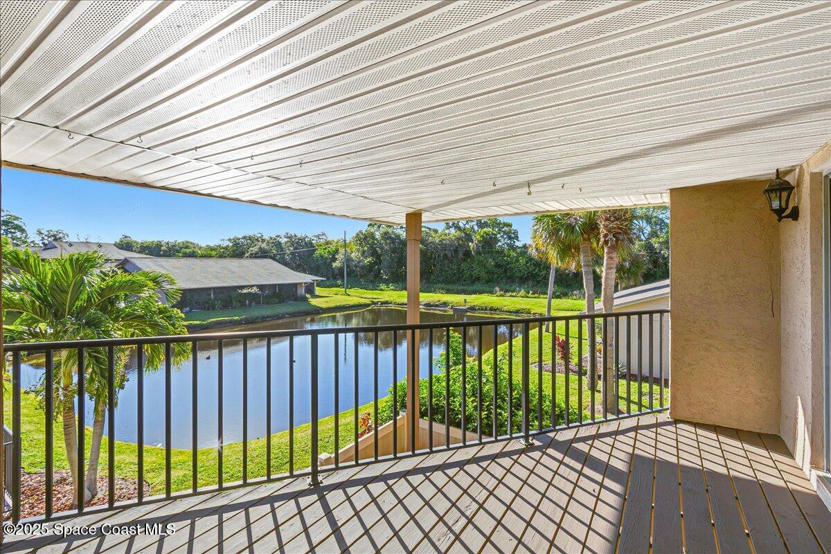4129 Bond Avenue Rockledge, FL 32955 - Photo 28 of 45 a balcony with trees in front of it