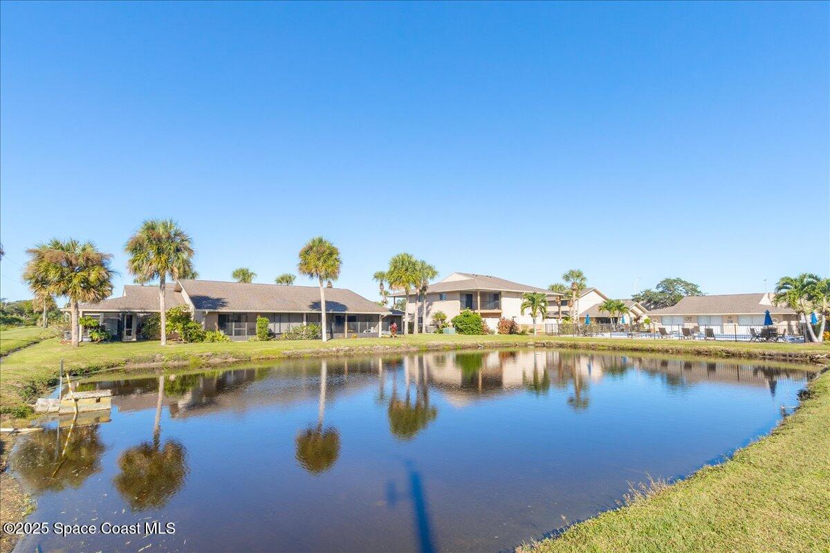 4129 Bond Avenue Rockledge, FL 32955 - Photo 3 of 45 a view of an ocean with boats and trees in the background