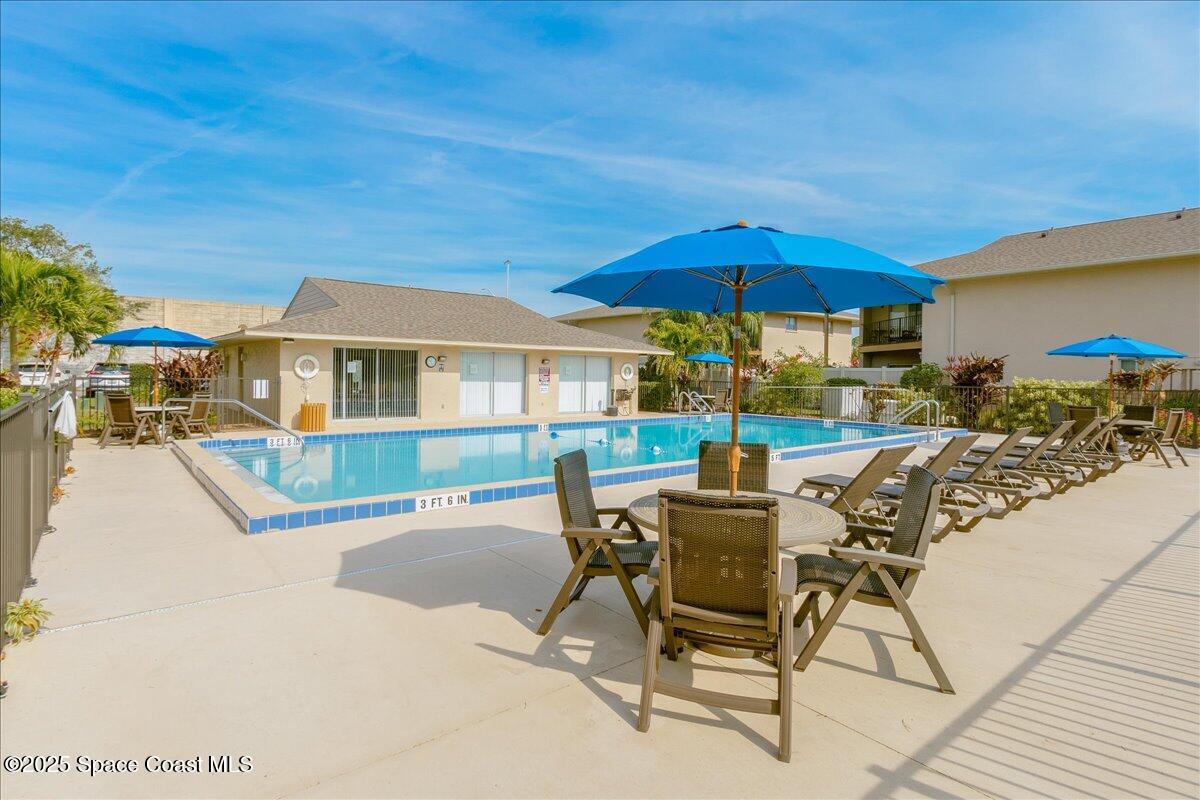 4129 Bond Avenue Rockledge, FL 32955 - Photo 34 of 45 a view of a house with backyard porch and sitting area