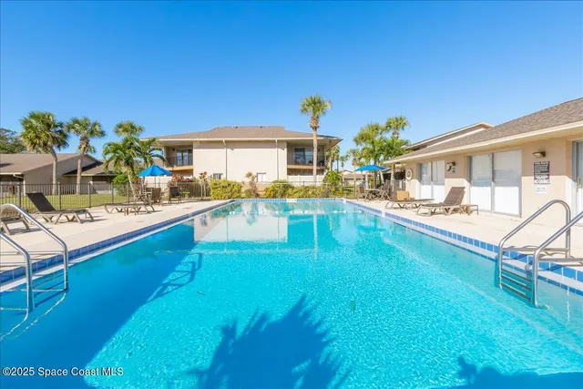 a view of a house with swimming pool