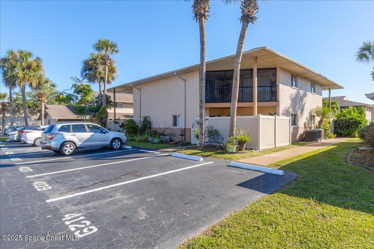 4129 Bond Avenue Rockledge, FL 32955 - Photo 7 of 45 a view of a parked cars in front of a house