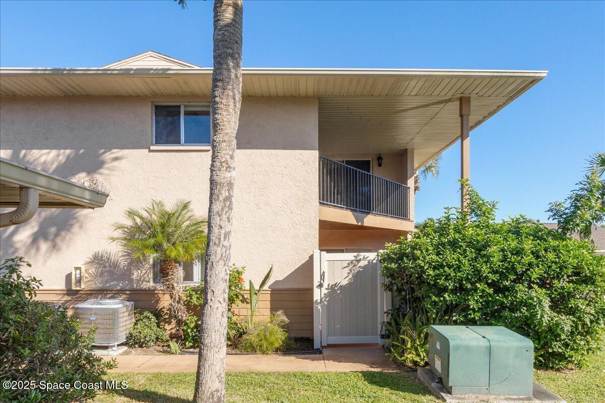 4129 Bond Avenue Rockledge, FL 32955 - Photo 8 of 45 a front view of a house with a yard and garage
