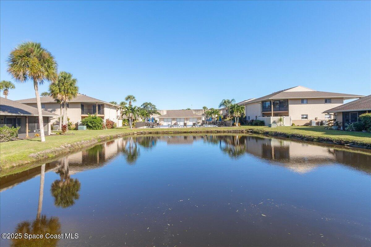 4129 Bond Avenue Rockledge, FL 32955 - Photo 9 of 45 a view of a lake with a house in the background