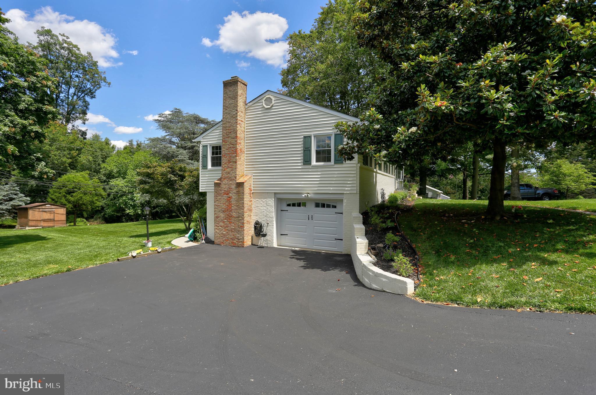 4613 Roundhill Road Ellicott City, MD 21043 - Photo 35 of 39 Exterior Side/Driveway/Garage
