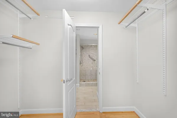 a bathroom with a glass shower door